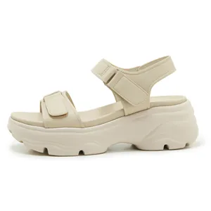 Beige platform sandals with adjustable hook-and-loop straps for summer beach wear