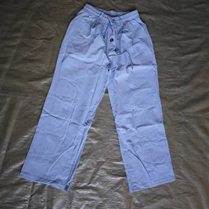 Men's light blue breathable linen loose casual long pants with drawstring waist design