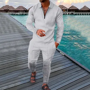 Men's grey textured 2-piece polo suit set shown on an outdoor resort boardwalk