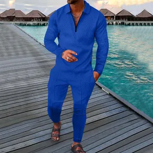 Men's royal blue textured knit tracksuit set with half-zip polo and matching trousers