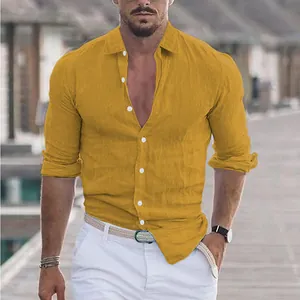 Close-up of mustard yellow linen-cotton long-sleeve beach shirt with button details.