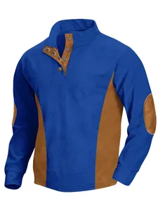 Detail of men's blue ribbed corduroy shirt with contrast brown panels and elbow patches
