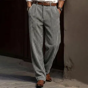 Close-up of grey corduroy texture and loose straight-leg fit on these men's trousers