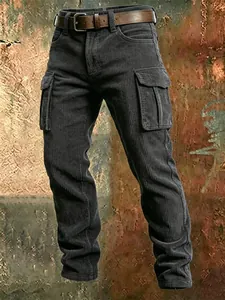 Detail view of men's charcoal slim-fit corduroy cargo pants with multiple utility pockets