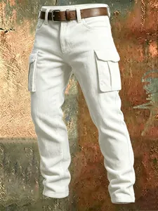 Detail view of men's white slim-fit corduroy cargo pants with large side pockets