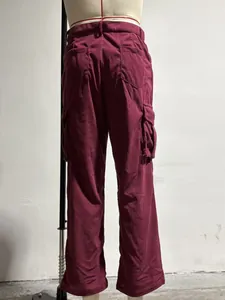 Detailed back view of men's burgundy corduroy cargo pants with multi-pockets design