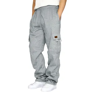 Close-up detail of men's loose grey cargo sweatpants with multiple utility pockets