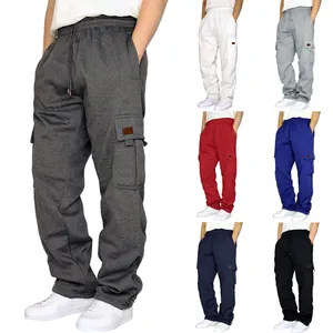 Detail view of men's loose cargo sweatpants with multi-pockets and a drawstring waist.