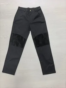 Detailed view of men's cotton outdoor work trousers with corduroy knee patches