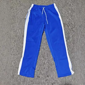 Blue men's breakaway basketball pants with white side stripes and side snap buttons.