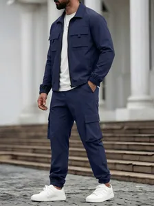 Detailed view of men's navy blue cargo jacket and matching utility trousers set