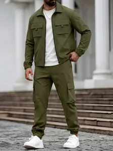 Lifestyle shot of the men's olive green cargo jacket and matching utility trousers.