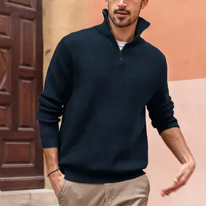 Men's navy blue quarter-zip knit polo sweater in a lifestyle street setting