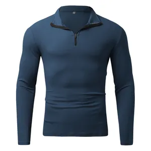 Slim fit men's long sleeve ribbed quarter-zip polo shirt in deep blue on white background