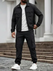Close-up view of a men's black utility cargo jacket and matching trousers outfit set