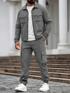 Detailed view of grey men's multi-pocket cargo jacket and matching utility pants