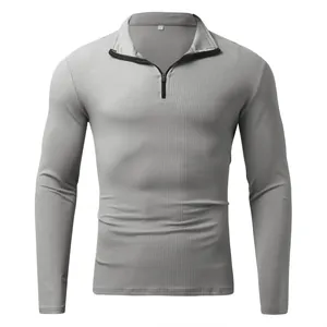 Detailed macro view of gray ribbed long-sleeve polo shirt with quarter zip collar