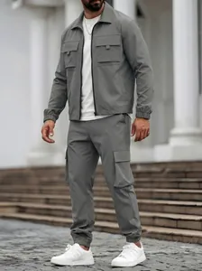 Stylish men's grey utility cargo set featuring multi-pocket jacket and matching jogger pants