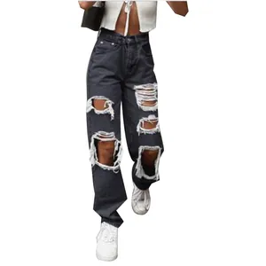 Detailed view of women's distressed black wide-leg jeans with large knee rips.