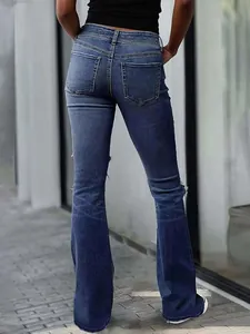 Back view of retro blue flared jeans for women with slim fit and ripped details
