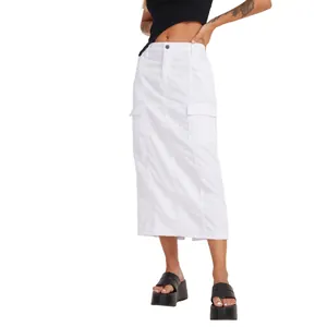 Detailed view of a white denim cargo midi skirt styled with black platform sandals on a model