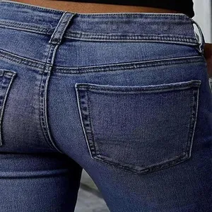 Close-up detail of vintage blue slim fit flare jeans featuring back pocket texture