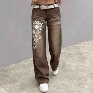 Vintage brown wide-leg jeans for women with white graphic heart print and studded belt.