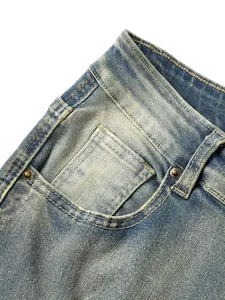 Detail of vintage washed blue denim jeans pocket with copper rivets and stitching