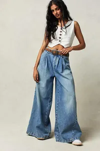 Full-length view of stylish high-waisted light blue wide-leg denim jeans with a relaxed fit.