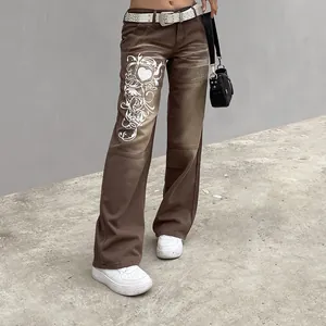 Detailed view of trendy brown wide-leg jeans with vintage heart print graphic design.