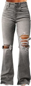 Close-up of women's vintage grey ripped flare jeans showing distressed knee details.