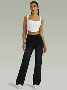 Full body view of women's high-waisted black stretch straight-leg denim jeans