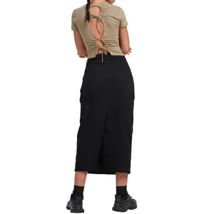 Back view detail of a long black bodycon skirt paired with a cutout tie-back top