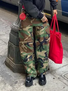 Street style shot of men's loose camouflage cargo pants with classic woodland print
