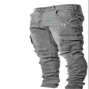 Detailed view of grey slim-fit cargo denim pants with multiple side pockets for men.