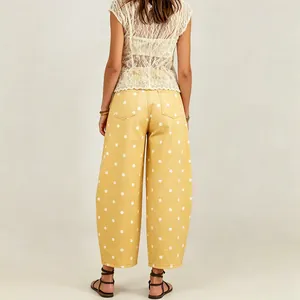 Detailed back view of yellow polka dot barrel jeans with a relaxed fit and cropped hem