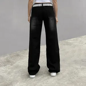 Back view of women's black wide-leg denim jeans with rhinestone belt and washed finish.