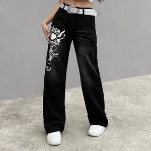 Close-up detail of black wide-leg jeans with retro white heart and vine graphic print