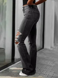 Professional side view of distressed flare jeans featuring ripped knee details and slim fit