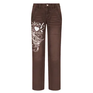 Detail view of brown wide-leg jeans featuring a stylish white Y2K heart and floral print.