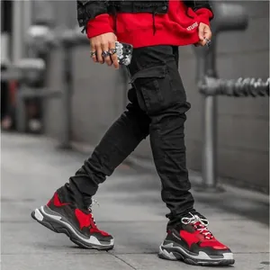 Men's black slim fit cargo denim pants with functional side pockets in streetwear style