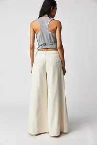 Back view of women's off-white wide-leg casual denim pants in American street style.
