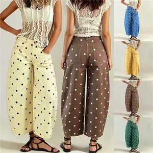 Detailed view of women's polka dot wide-leg cropped jeans in multiple vibrant colors