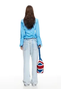 Rear view of light wash wide-leg denim jeans featuring classic large back pockets