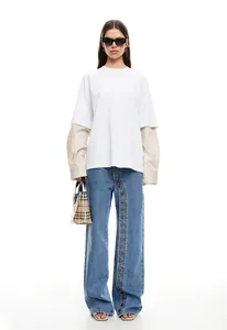 Detailed view of women's wide-leg denim jeans with unique multi-button fly closure