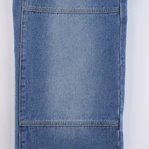 Close-up macro view of blue denim fabric with high quality reinforced double stitching detail