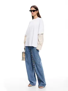 Chic streetwear wide-leg denim jeans for women featuring a unique multi-button side design