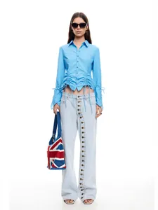Street style light wash wide leg jeans with unique multi-button side closure