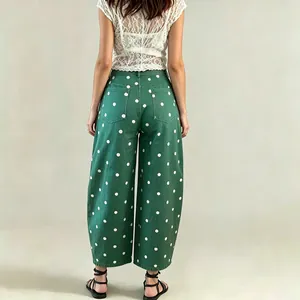 Detailed back view of green polka dot barrel jeans with loose wide-leg cropped fit