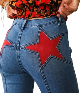 Close-up detail of the vibrant red star patch on stylish blue stretch denim jeans